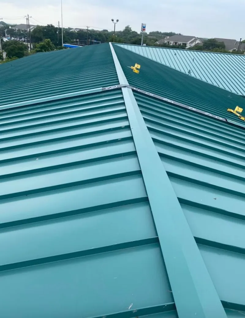 Green commercial metal roof ridge and valley for Metal Roof Repair in Eagle